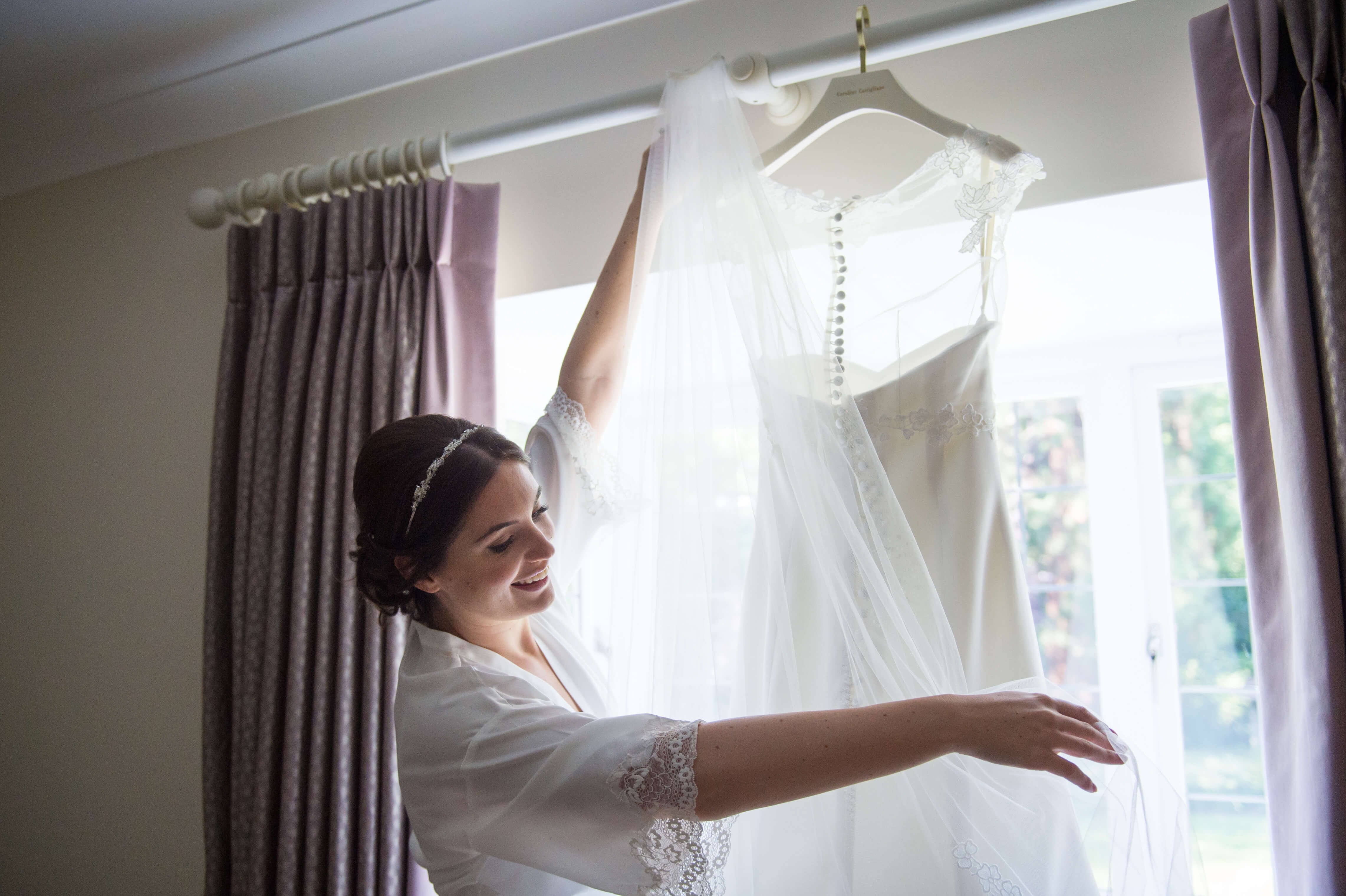 bridal hanging her caroline castigliano wedding dress by especially amy wedding photography
